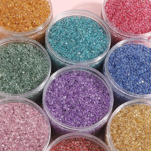 Colorful 4mm faceted glass beads set in clear jars for DIY jewelry making kits