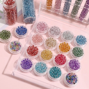 Detail of 4mm colorful glass seed beads set in transparent storage boxes for DIY jewelry