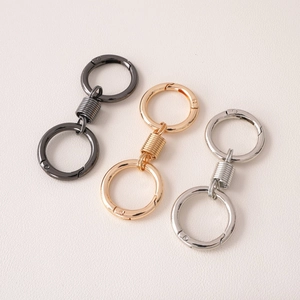 Three-color metal double spring ring keychain clips in gold, silver, and gunmetal black finish