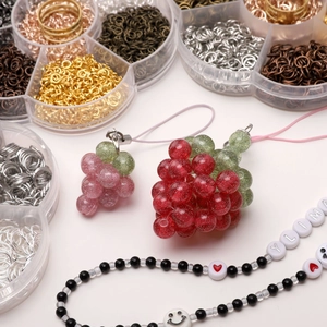 DIY jewelry making kit featuring colorful jump rings, grape pendants, and beaded necklace