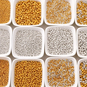 Golden and silver glass seed beads in multiple sizes for DIY jewelry making and crafts