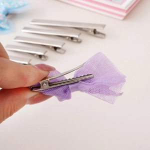 Flat top silver metal hair clips set with a purple mesh bow accessory for DIY