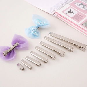 Assorted silver metal alligator hair clips and mesh bow hairpins for DIY crafts