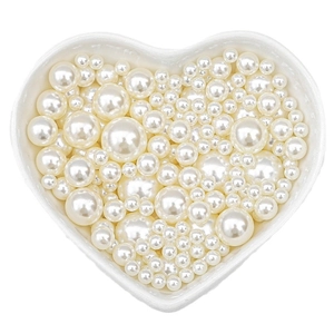 Mixed size creamy white faux pearls in heart dish for DIY jewelry making and crafts