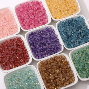Macro view of 4mm frosted glass beads with gold foil inside for DIY jewelry making