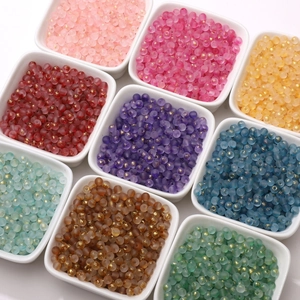 Macro view of 4mm frosted glass seed beads with gold foil in nine color trays