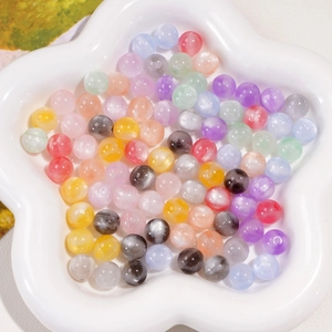 Macro shot of 10mm colorful resin beads with pearlescent finish for DIY jewelry