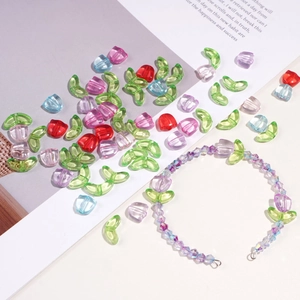 Macro shot of colorful acrylic tulip flower beads and handmade DIY beaded bracelet