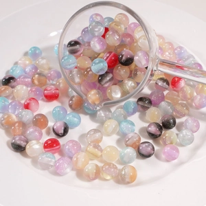 Close-up of 10mm resin beads with misty pearl effect for DIY jewelry making and crafts