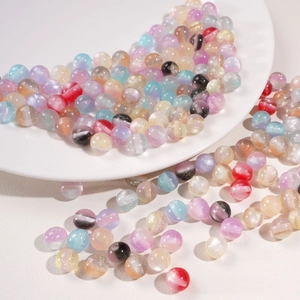 Macro shot of 10mm misty resin beads with glitter for DIY jewelry making
