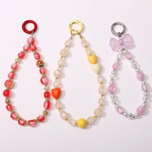 Detailed close-up of 10mm resin beaded phone straps in red, yellow and purple styles