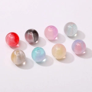 Macro shot of 10mm colorful resin beads with glitter for DIY jewelry making and crafts