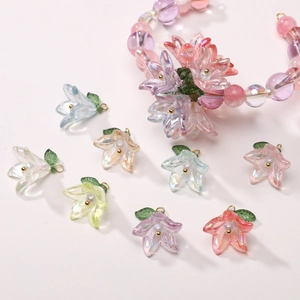 Macro shot of lily lily pendants with iridescent acrylic and pearl charms for DIY jewelry