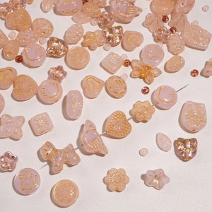 DIY pink glass bead set with gold butterfly heart patterns for jewelry making