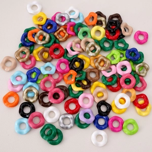 Macro detail of glossy colorful acrylic irregular ring beads for DIY jewelry making