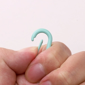 Close-up of mint green alloy spray-painted lobster clasp for DIY jewelry making