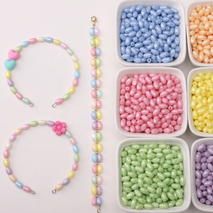 Macro view of macaron colored oval glass rice beads for DIY jewelry making material