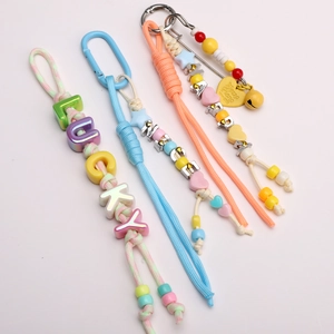Luminous nylon paracord keychain set with colorful letter beads and metal bells