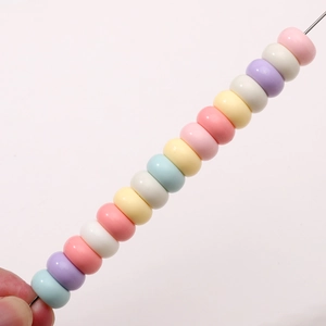 Flat round acrylic beads in pastel macaron colors for DIY jewelry making and crafts