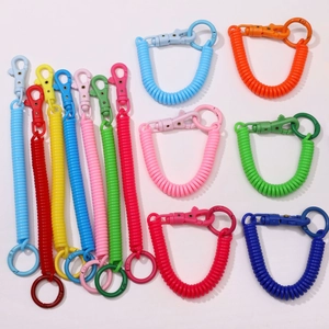 Close-up of colorful spiral spring keychains with matching lobster clasps and rings