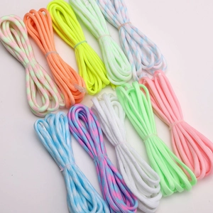Macro detail of assorted 4mm luminous nylon paracord bundles in vibrant colors