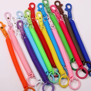 Colorful plastic spiral spring keychains with carabiner clips in multiple bright colors