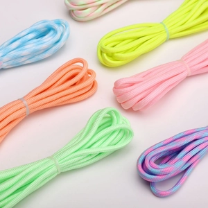 Detail showing various 4mm luminous nylon paracord bundles in vibrant neon colors