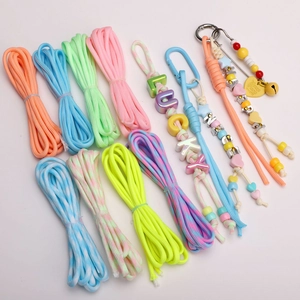 Detailed assortment of 4mm glow-in-the-dark paracords and DIY braided keychains with beads