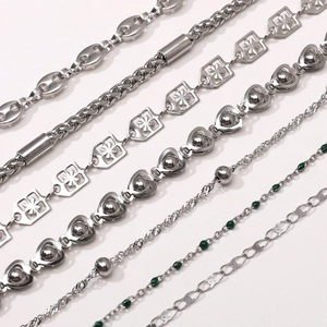 Detail showing six styles of silver stainless steel DIY jewelry chains with metal beads
