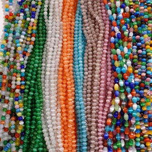 Vertical rows of multicolored cat eye glass beads in round and teardrop shapes