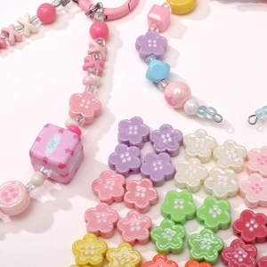 Colorful macaron acrylic flower beads and heart-shaped charms for DIY craft jewelry