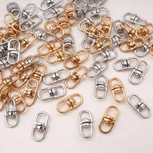 Close-up of gold and silver alloy swivel lobster clasps for DIY jewelry making and keychains