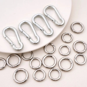 Detailed set of silver stainless steel spring snap hooks and O-rings for DIY accessories