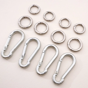 Flat lay of silver stainless steel snap hooks and spring O-rings for DIY craft accessories