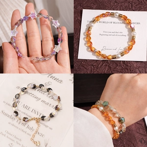 Handmade beaded bracelets with faceted glass, pearls, and star charms in four styles