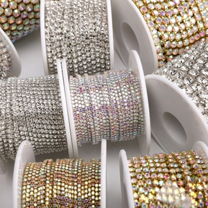 Close-up of multicolored rhinestone cup chains on spools for DIY jewelry making