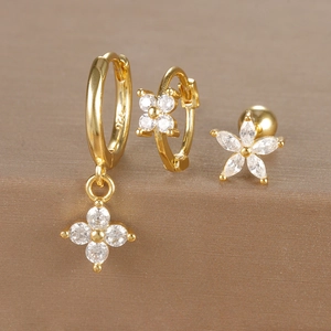 Detail view of 925 silver stamp on gold flower earrings with micro-pave cubic zirconia