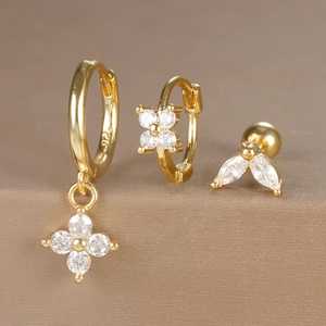 Detail of three-piece gold earring set with S925 sterling silver stamp and clear zircon