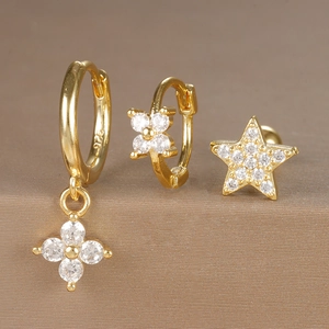 Macro shot showing S925 hallmark on gold clover and star earring set with zircon