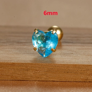 Macro shot of 6mm heart-shaped light blue stud earring with golden screw back base