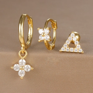 Detailed macro shot of 925 sterling silver gold-plated earring set with zircon accents