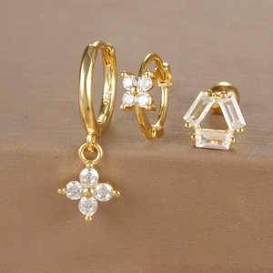 Macro detail of gold-plated S925 silver earrings set with micro-set zircon floral patterns
