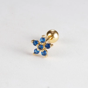 Floral gold piercing earring with six deep blue gemstones and a secure screw ball back