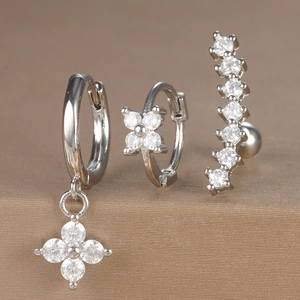 Three-piece silver earring set with clover zircon pendants and curved crystal ear studs