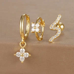 Macro shot of S925 sterling silver stamp on gold flower and snake earring set with zircons