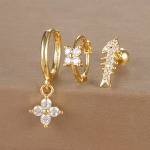 Macro shot of gold-plated silver earring set with 925 hallmarks and cubic zirconia details