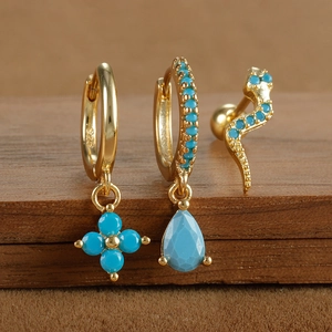 Macro shot showing the 925 silver stamp on gold plated turquoise drop earrings set