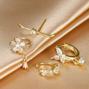 Macro detail of 18k gold plated floral fringe earring set with sparkling zircon inlays