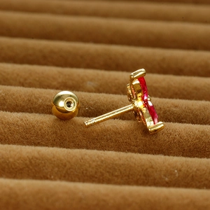 Golden butterfly stud earring with red marquise stones and screw ball back