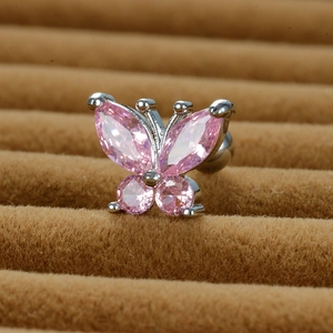 Macro detail of butterfly ear stud with pink zircon and stainless steel screw back ball